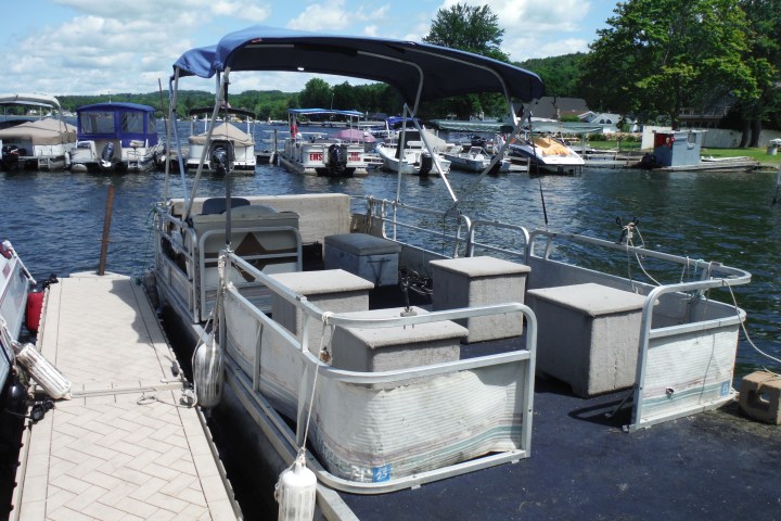 a boat is docked next to a body of water